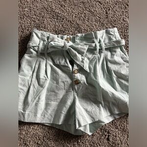 High waist linen button closure shorts with tie.